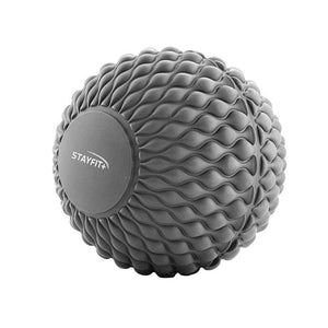 Grey massage ball with knobs all over meant for massages